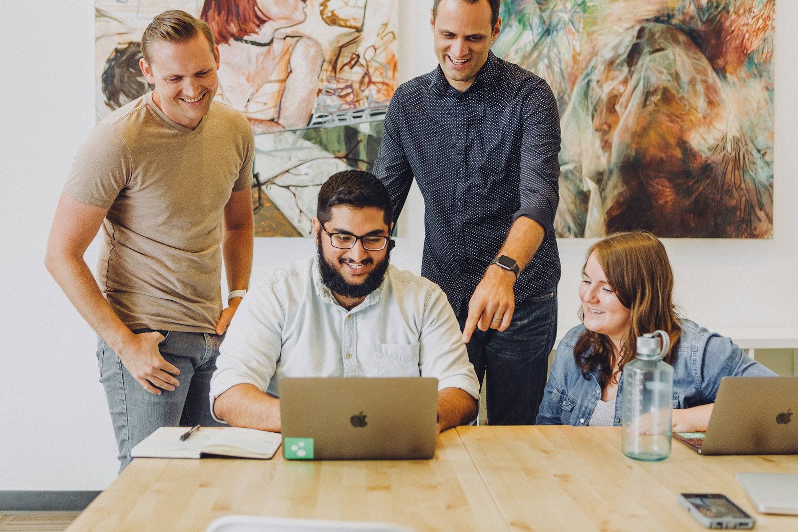 Illustrative photograph of a team exchanging ideas